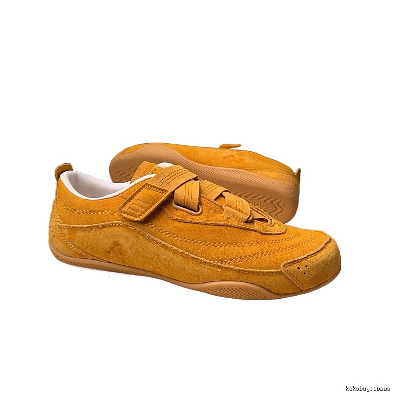Adidas retro-style yellow sneakers.